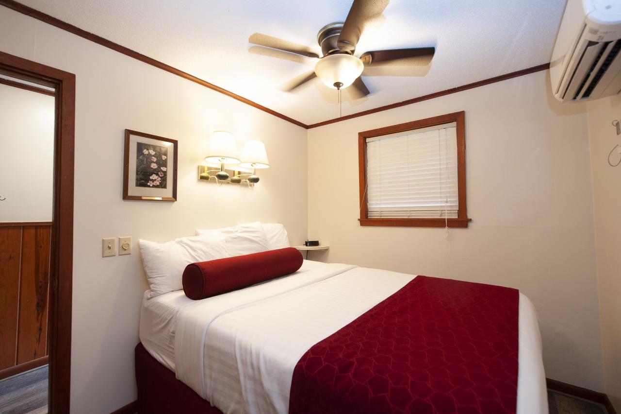 A view of the bed in one of the bedrooms at Cabin 3 at Crowley's Ridge State Park